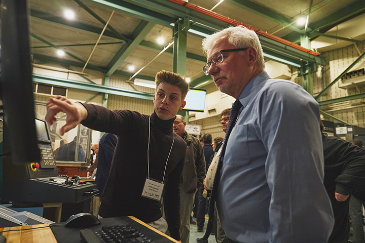 A student gives John Preston a demonstration at the MMRI Open House in 2019.