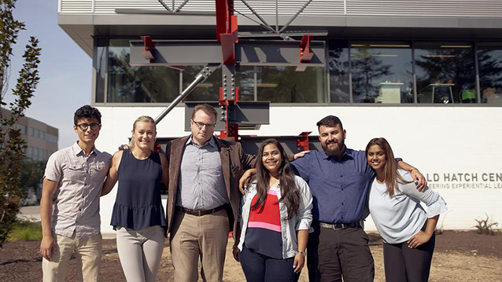 A group of people pose outside Hatch