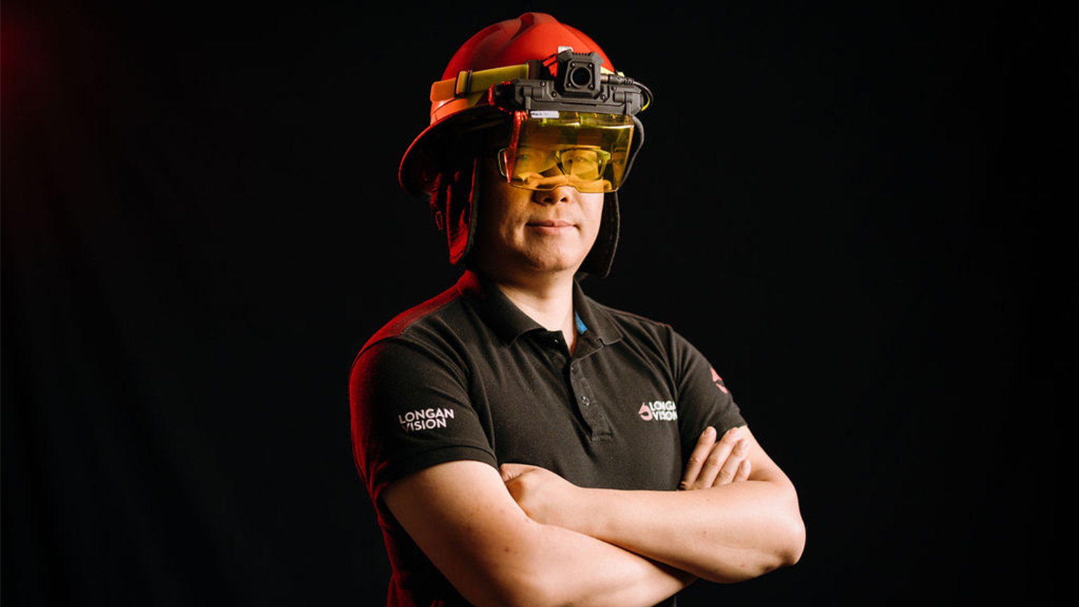 Enzo Jia wears an augmented reality visor for firefighters.
