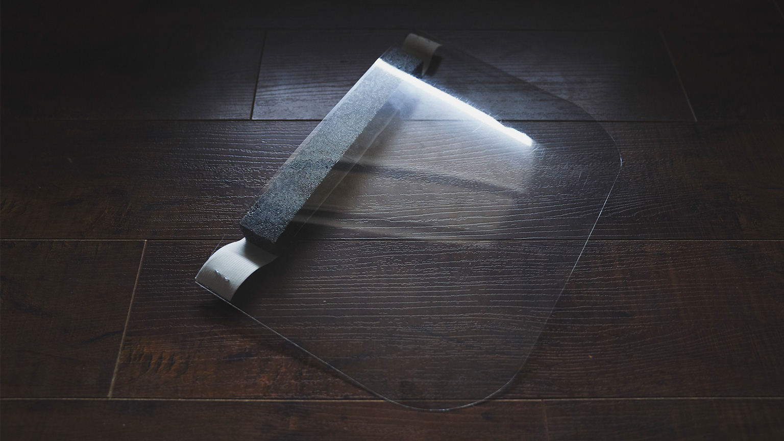 a face shield on a hardwood floor