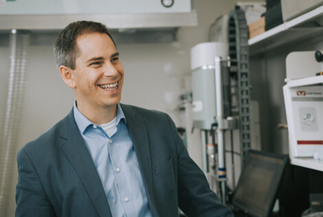 Greg Wohl smiling in a lab