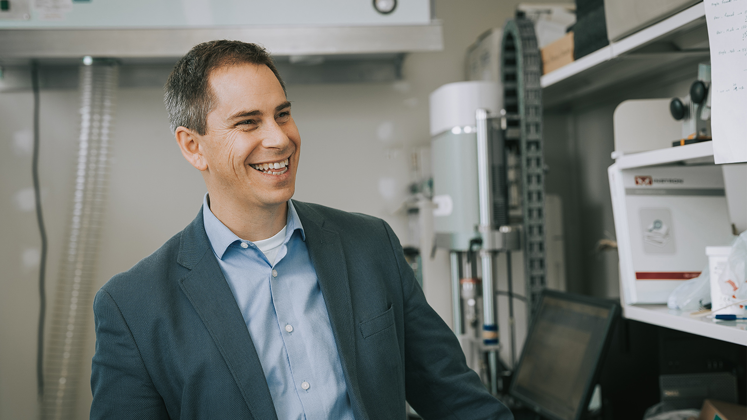 Greg Wohl smiling in a lab