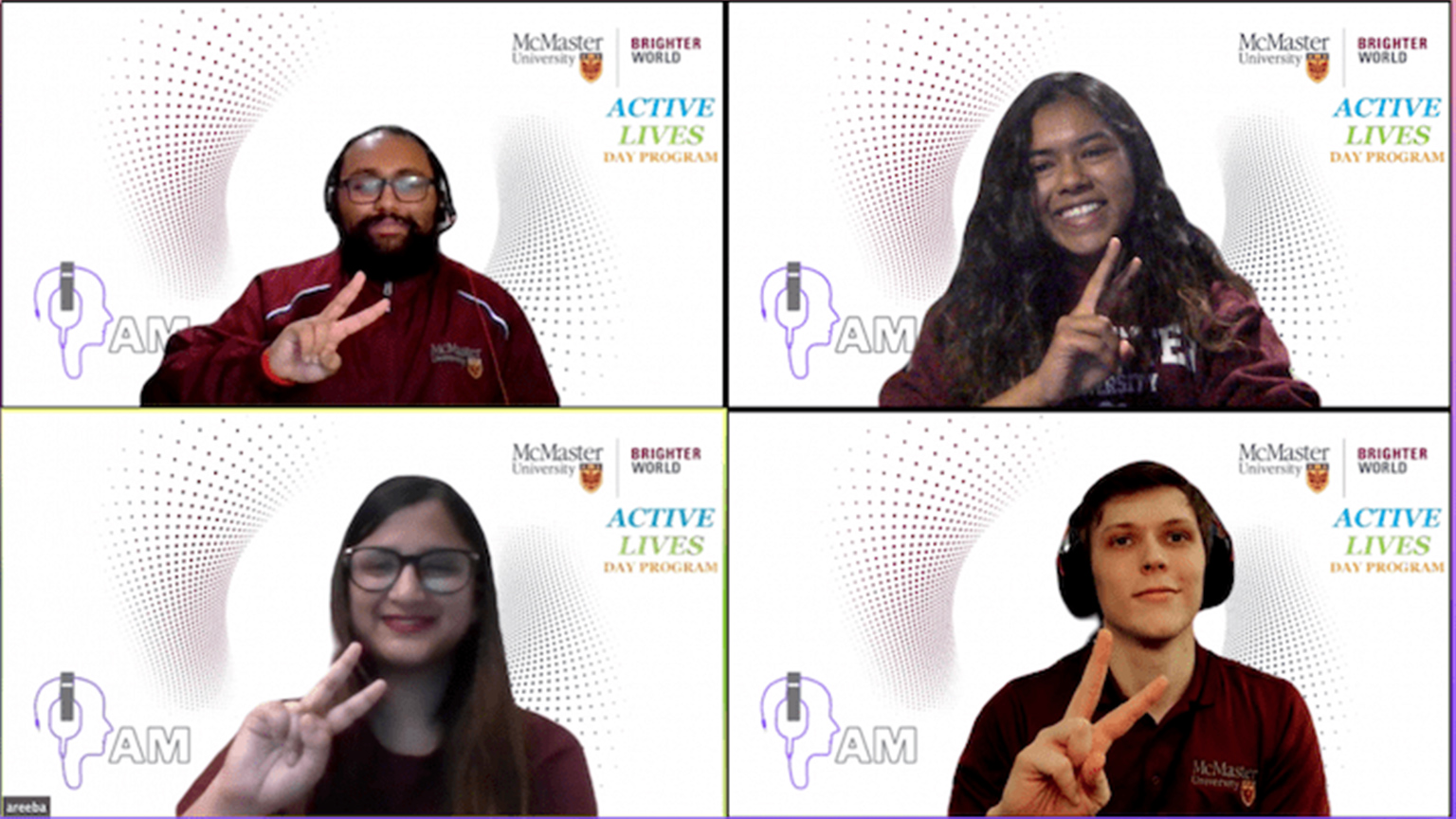 four students on Zoom giving peace signs with their hands.