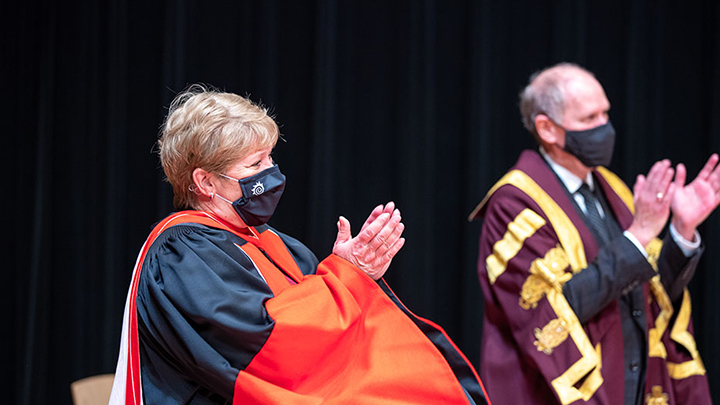 Heather Sheardown claps next to David Farrar.