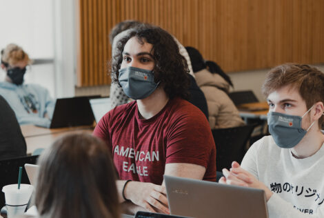 two students wearing McMaster face masks