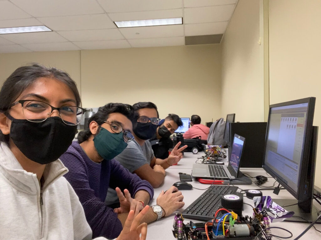 A line of students sitting at line of computers