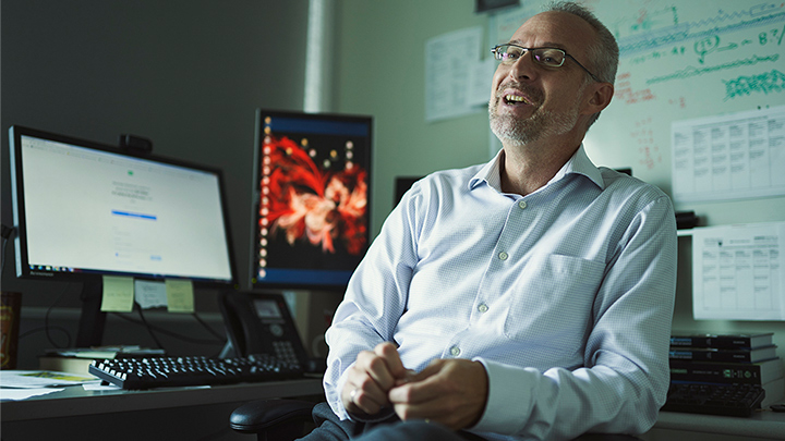 Michael Justason sits in his office