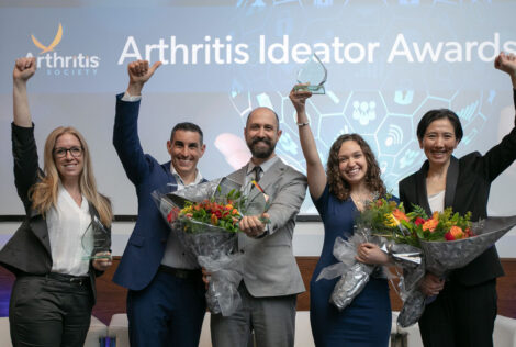 Winners of the Arthritis Ideator Awards hold their arms up