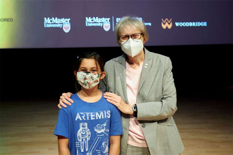 Roberta Bondar poses with a young girl, who loves science and art.