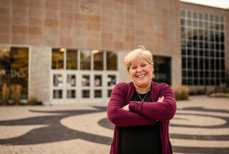 Heather Sheardown stands with her arms crossed outside of Johns Hodgins Engineering Building