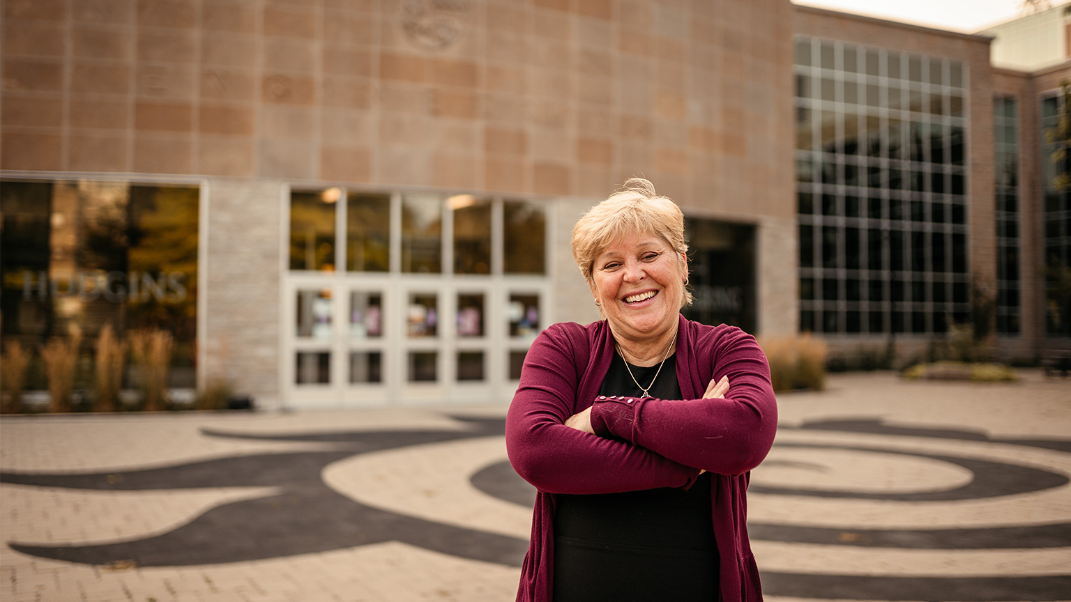 Heather Sheardown stands with her arms crossed outside of Johns Hodgins Engineering Building