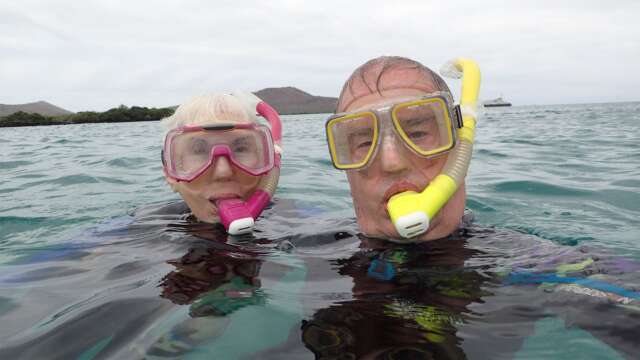 John Bandler and his wife, Beth Bandler, snorkelling in the Galapagos Islands in 2015.