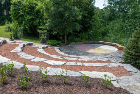 The Indigenous Circle features tiered stone arranged around a stage in the form of a medicine wheel, a symbol that represents the interconnectivity of all beings. Plantings in the space were sourced from Six Nations of the Grand River