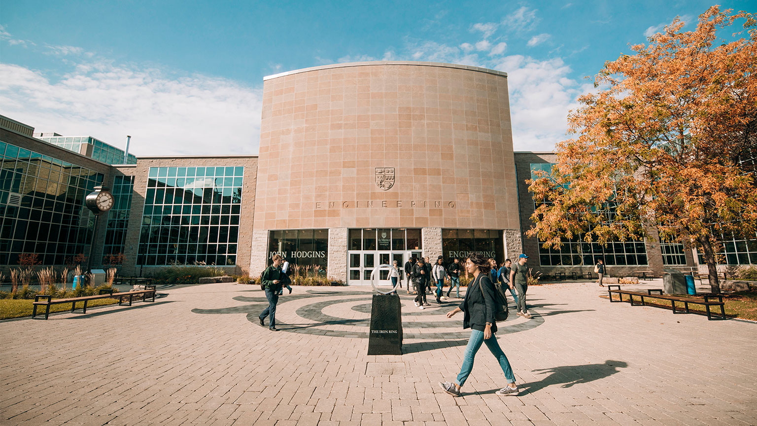 people walking by JHE entrance