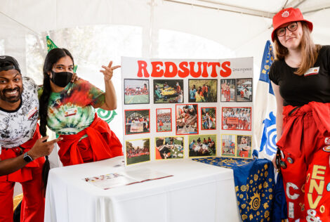 Redsuits stand at a booth at May at Mac.