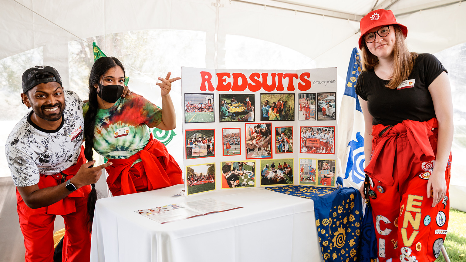 Redsuits stand at a booth at May at Mac.