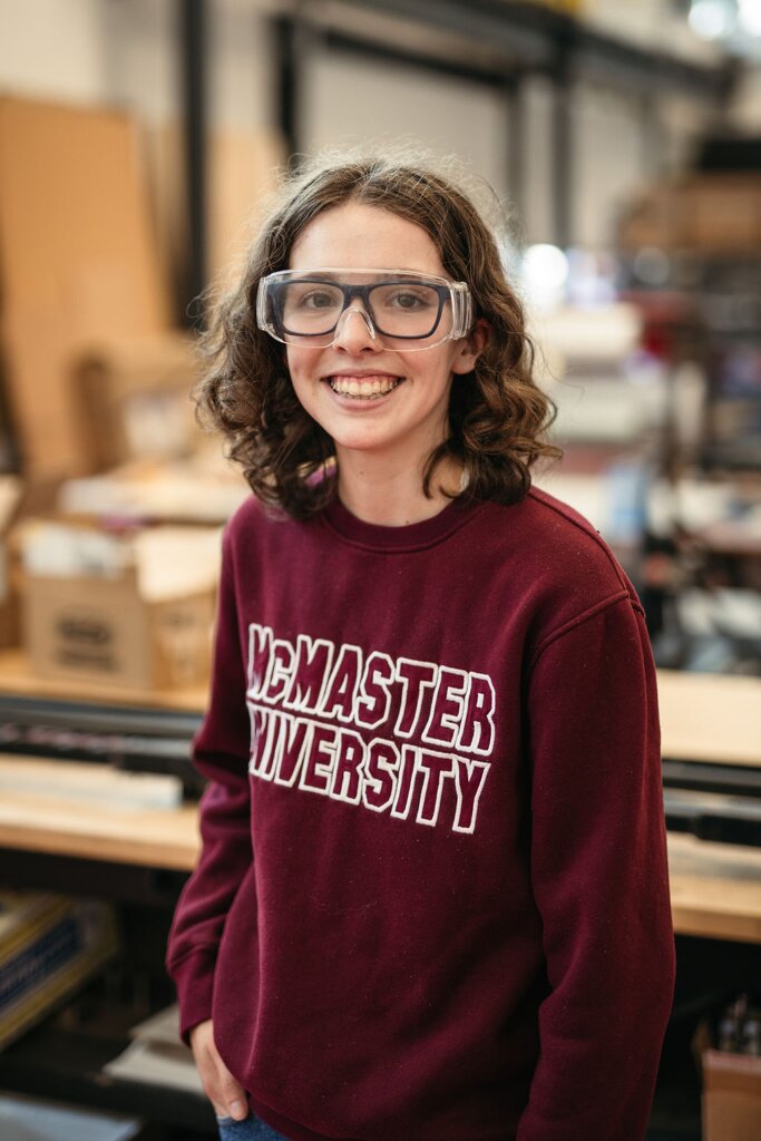 Julia Dowson wears a McMaster University sweater and safety goggles.