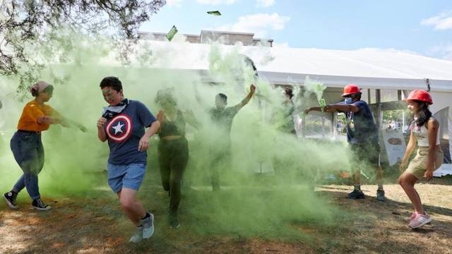 group of people in green powder.