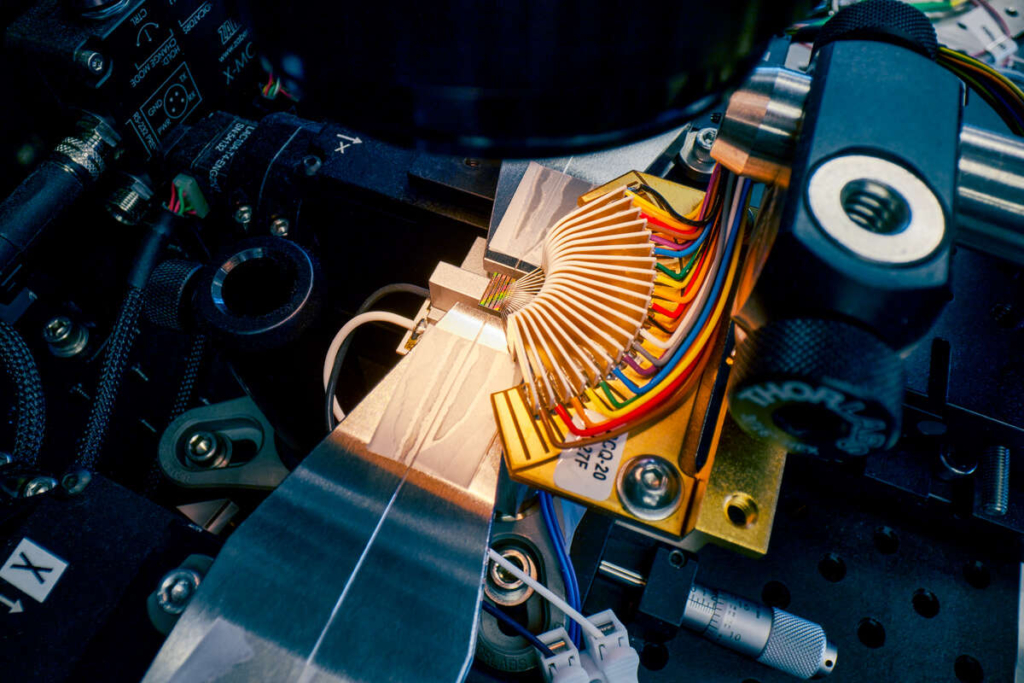 Active photonic chip undergoing testing.