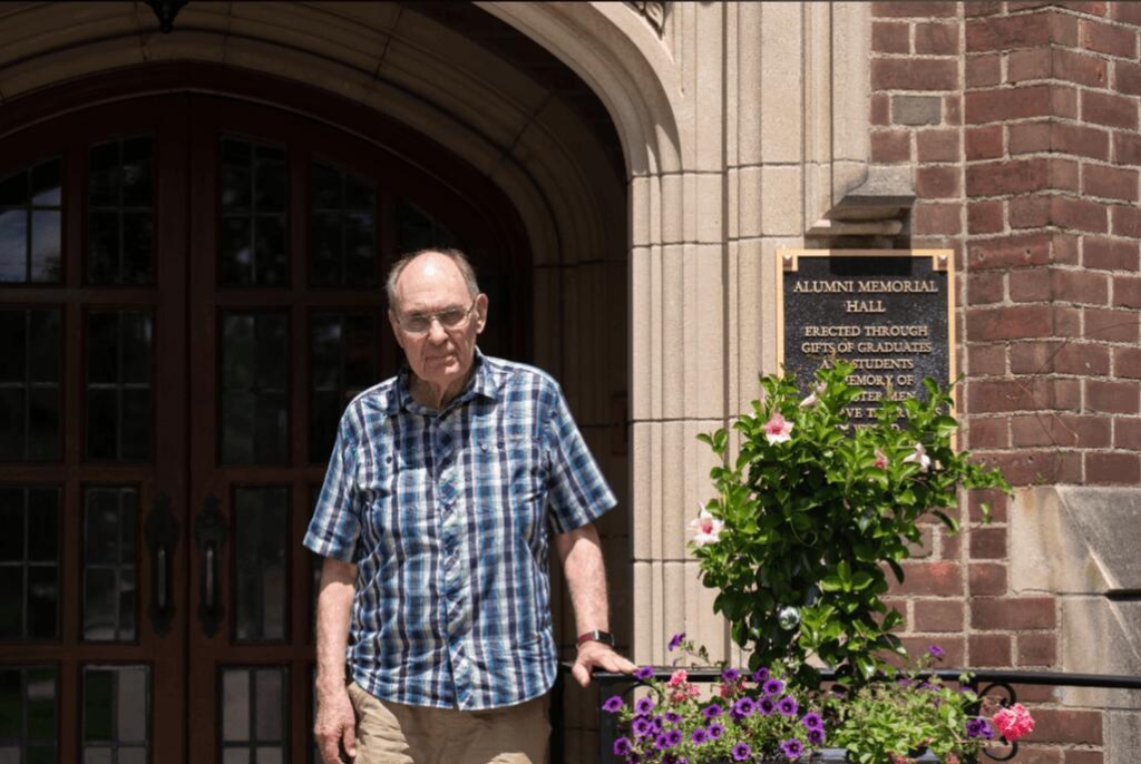 Gary Purdy in front of Alumni Memorial Hall
