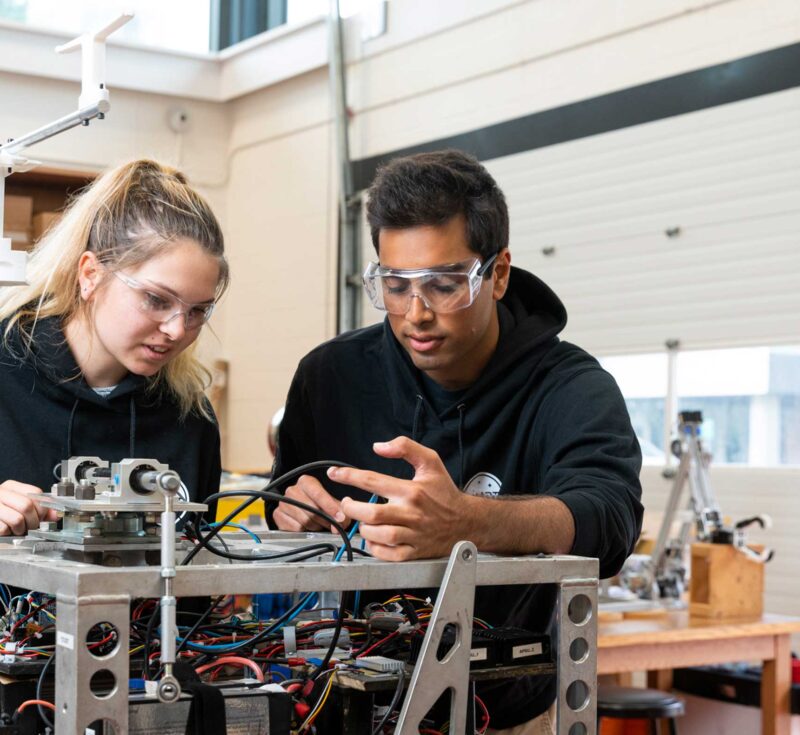 Students working on machine