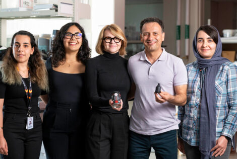 BFree research team pose together holding the period cup