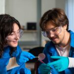 Students examining solar cell material