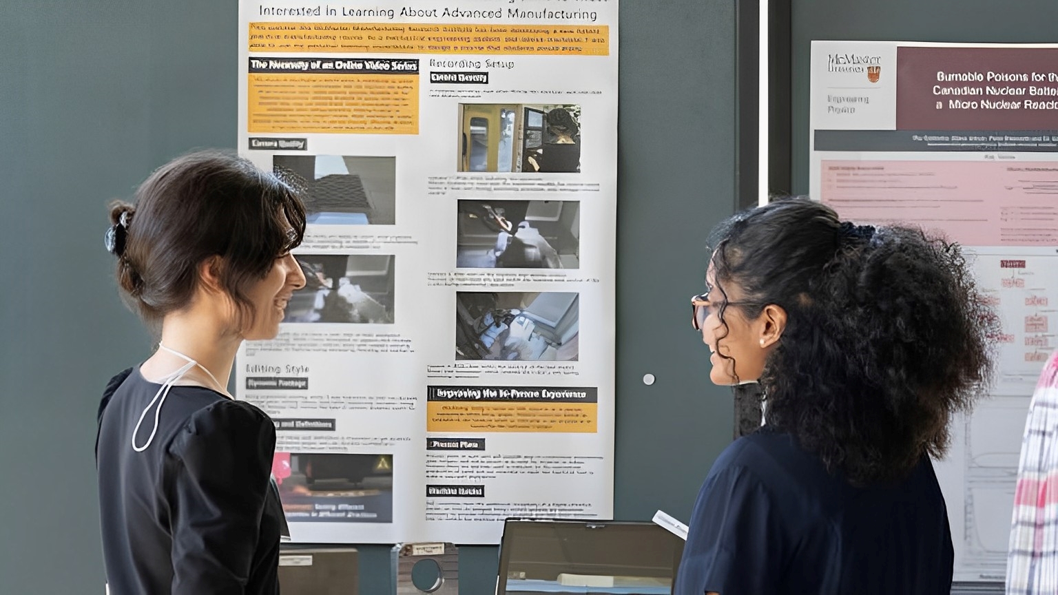 two people looking at a presentation board.