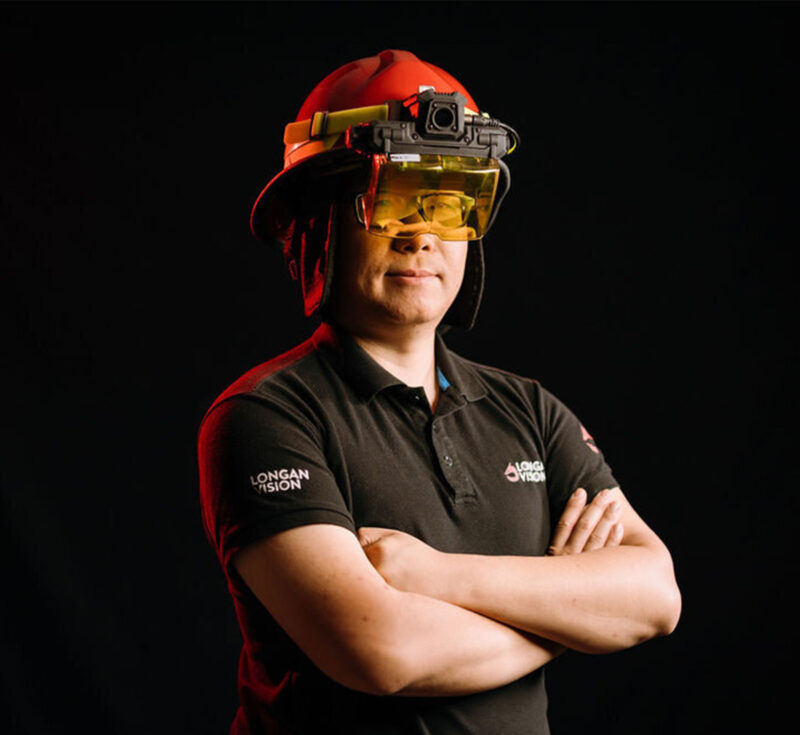 Enzo Jia wears an augmented reality visor for firefighters.