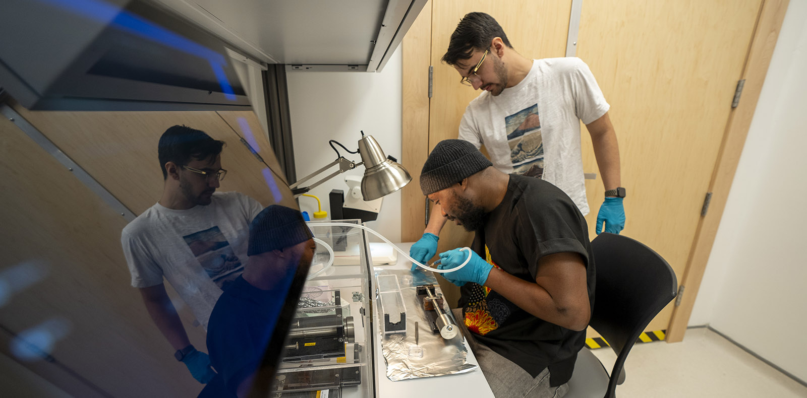 Grad students preparing materials in the Canadian Centre for Electron Microscopy