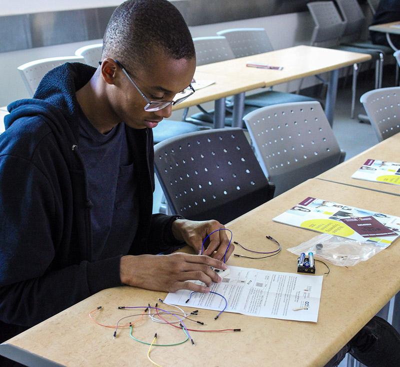 High school student concentrating on a STEM activity