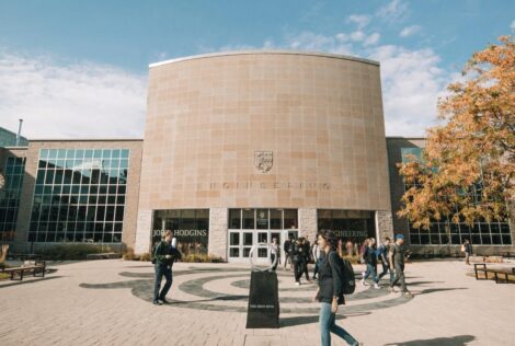 JHE building, students walking around the building