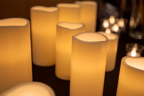 lit candles on a table.