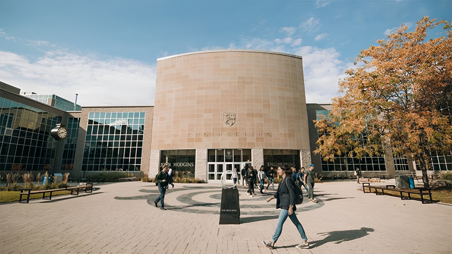 people walking by JHE entrance