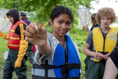 Grade 9 Khadeeja Fazal shows off a bug they found beneath a rock as part of a day filled with STEAM activities organized by McMaster and University of Waterloo.
