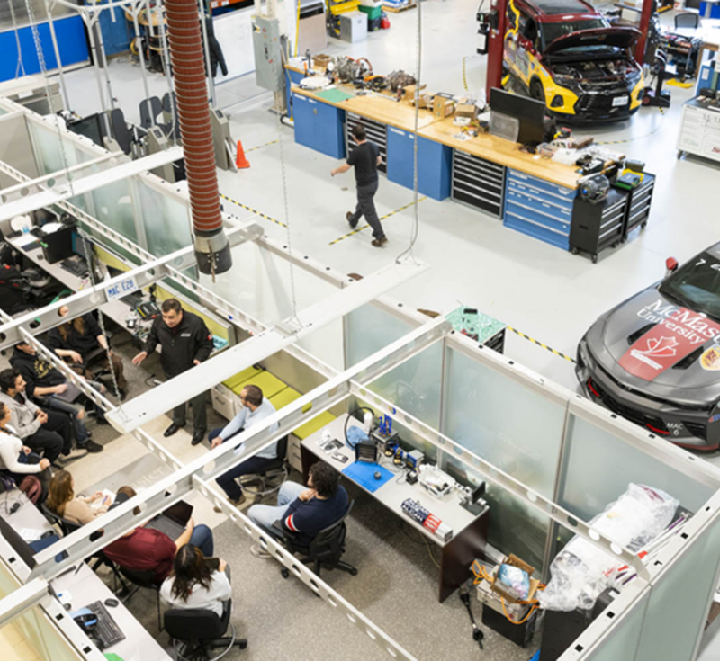Overhead view of people working and learning in the McMaster Automotive Research Centre