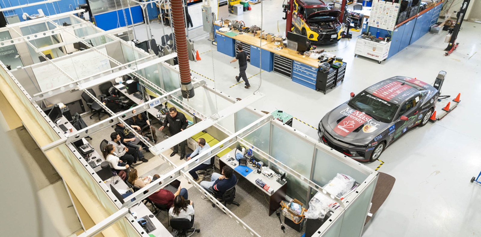 Overhead view of people working and learning in the McMaster Automotive Research Centre