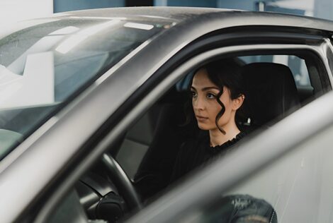 Maryam Alizadeh sits in a vehicle.