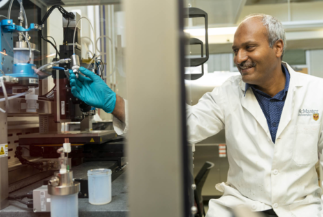 Professor Ravi Selvaganapathy working with equipment in a lab