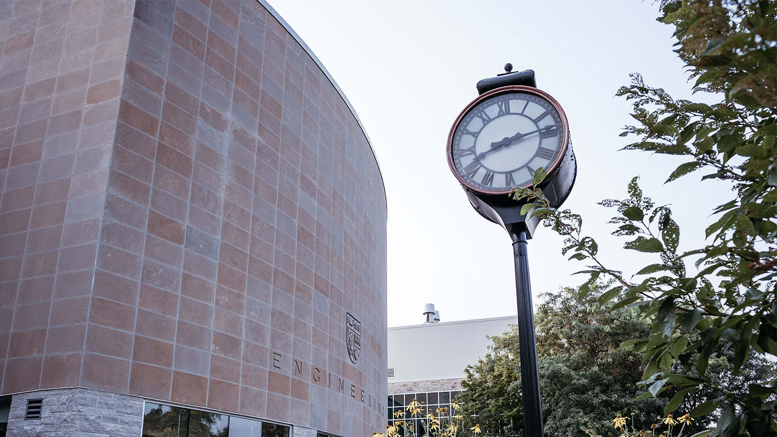 A clock outside the John Hodgins Engineering Building