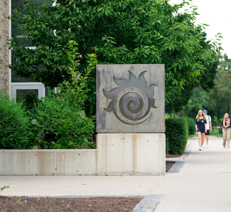 A person walks past the Fireball outside Hatch