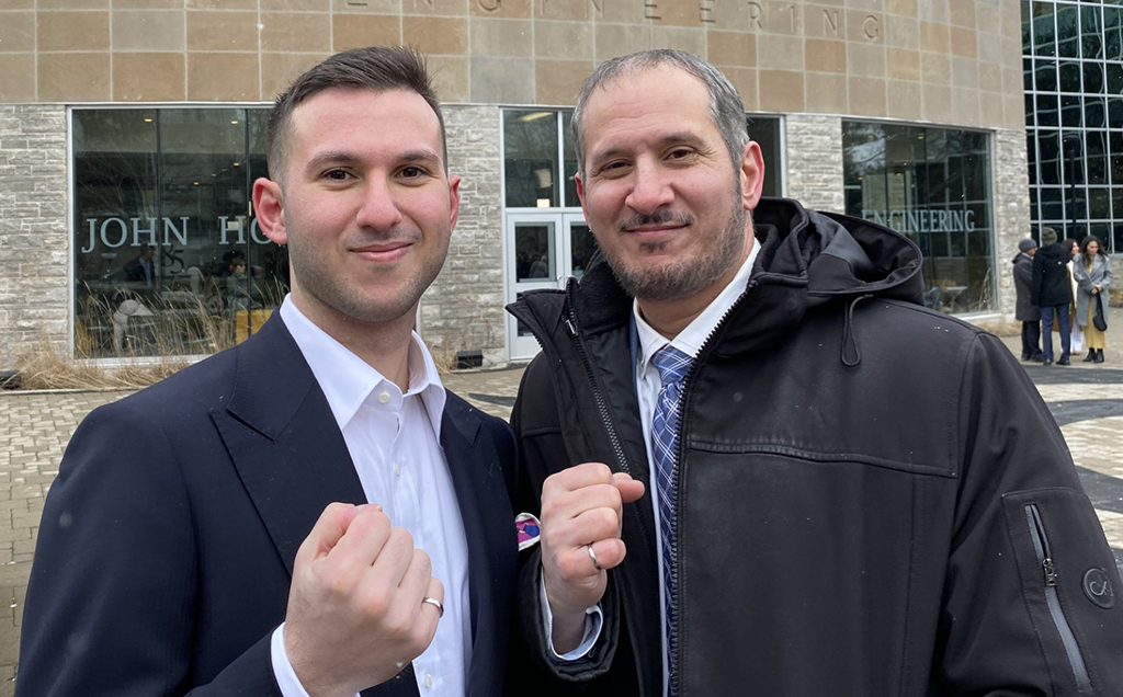The Carbone father and son duo pose with their Iron Rings