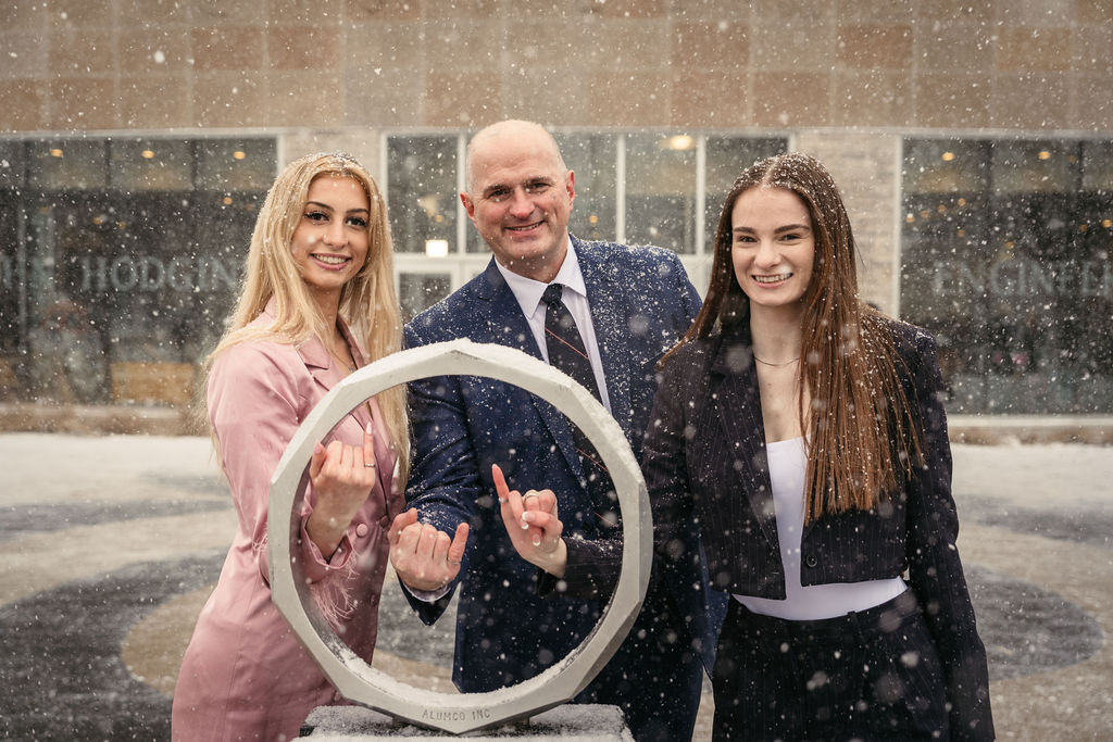 The Shrimpton family (father and two daugthers) pose with the Iron Rings