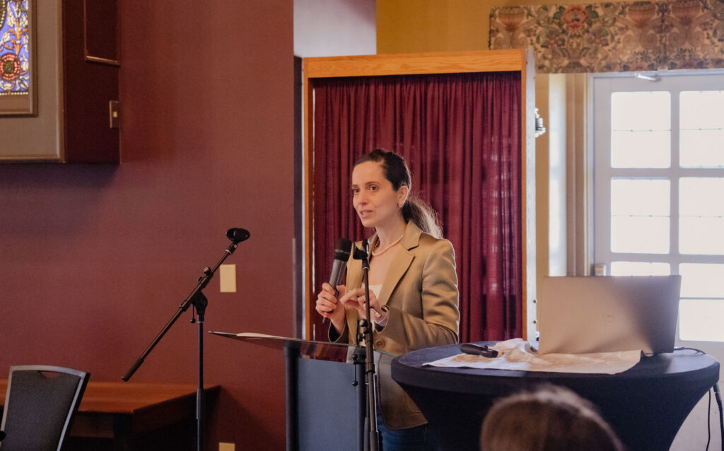 woman speaking at a podium. 