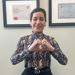 Marjan Alavi poses with heart hands