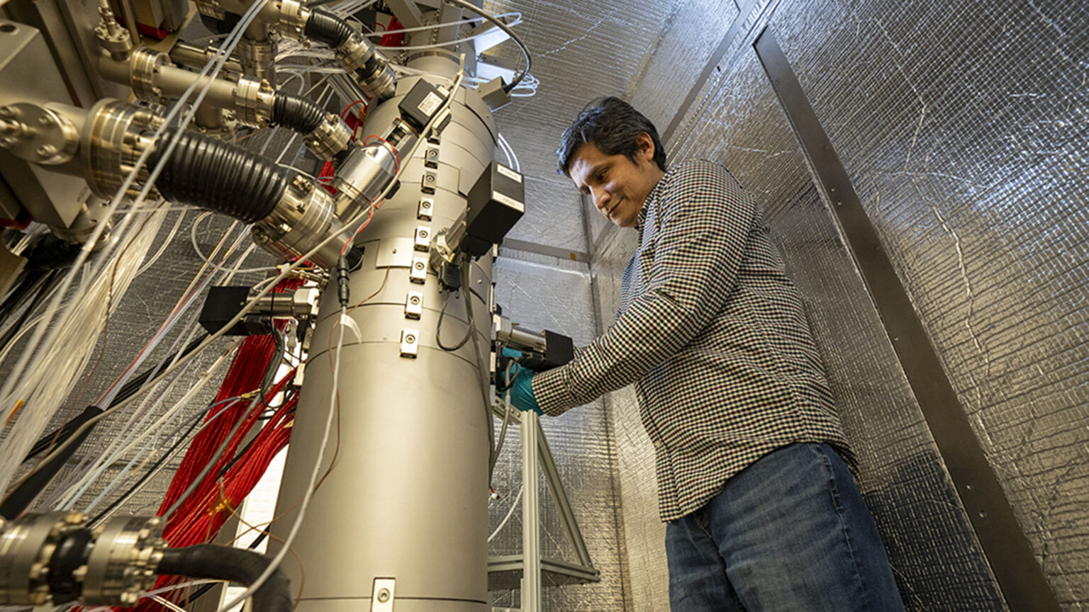 Dr. Maureen Joel Lagos working on the Nion HERMES 100 electron microscope.