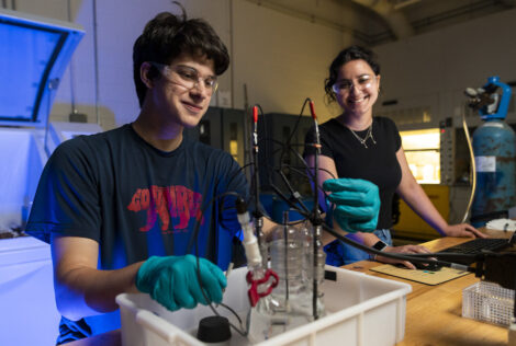 two students working in a materials engineering lab.