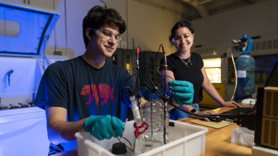 two students working in a materials engineering lab.