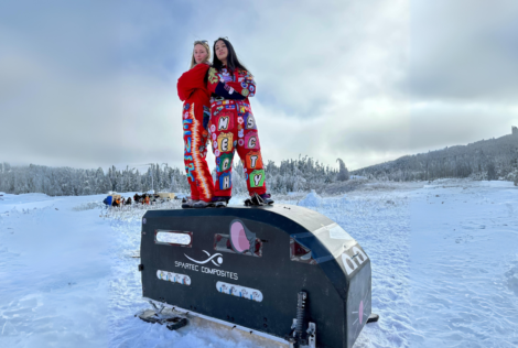 Kristin Seymour and Alisa Neang, co-subcaptains for the superstructure on the McMaster Engineering Concrete Toboggan Team, standing atop the toboggan