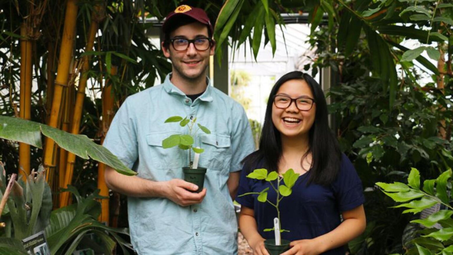 Michael Majcher and Kaylie Lau holding their plants
